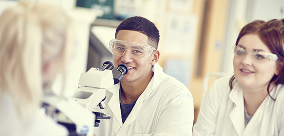 a man and a woman looking at the camera