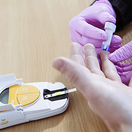 a hand holding a baby