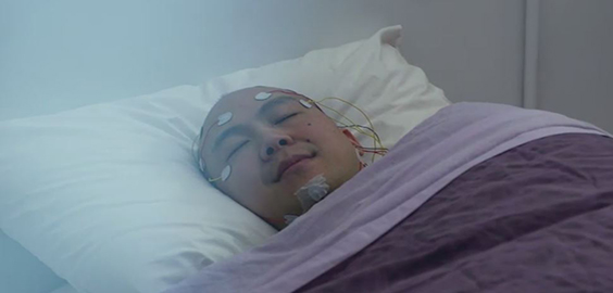 a person lying on a bed