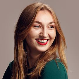 girl smiling and looking off the camera