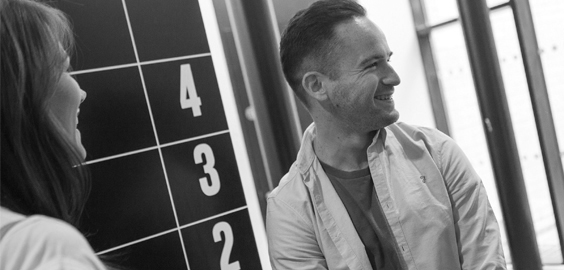 a man and a woman looking at the camera