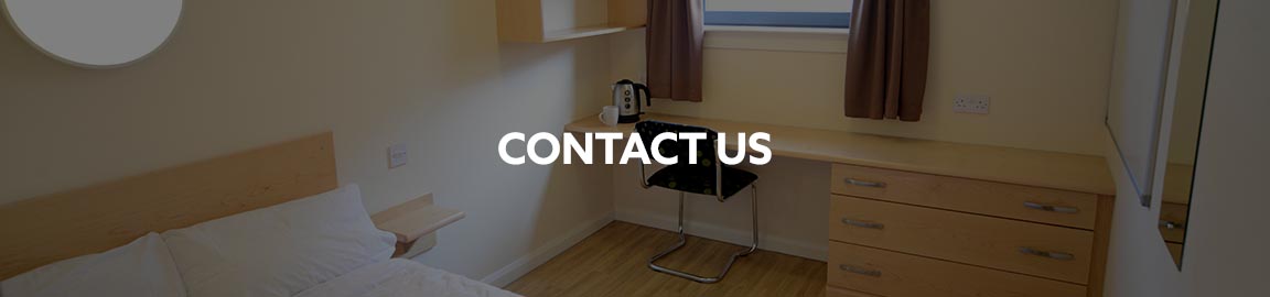 a bedroom with a wood floor