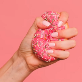 hand holding a donut