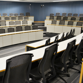 Blue room with office chairs and desks