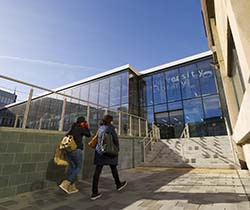 a group of people standing in front of a building