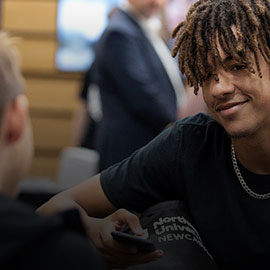 a man and a woman looking at the camera