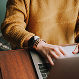 A person working on a laptop.