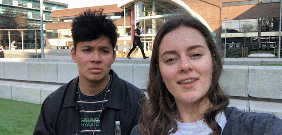 a woman standing in front of a building