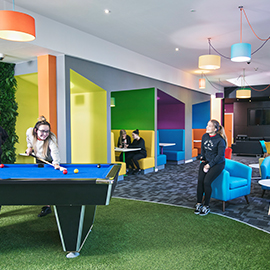 a room filled with furniture and a blue chair