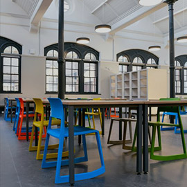 a chair sitting in front of a building