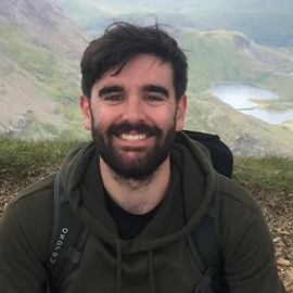 Bearded man smiling at the camera