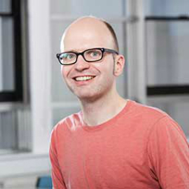 a man standing in front of a building