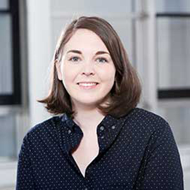 a woman standing in front of a building