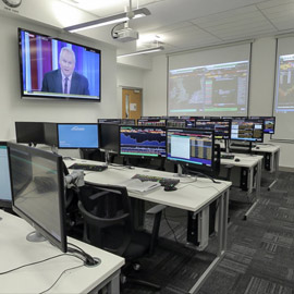 a room filled with furniture and a flat screen tv