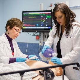 a person standing in front of a computer