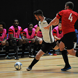 a group of young men playing a game of football