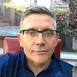 a man sitting at a table in a restaurant