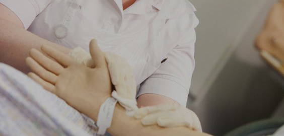 a hand holding a baby