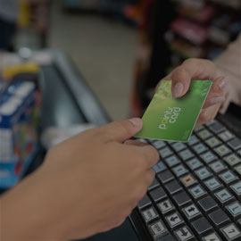 Image of a a person handing over a loyalty card to the cashier